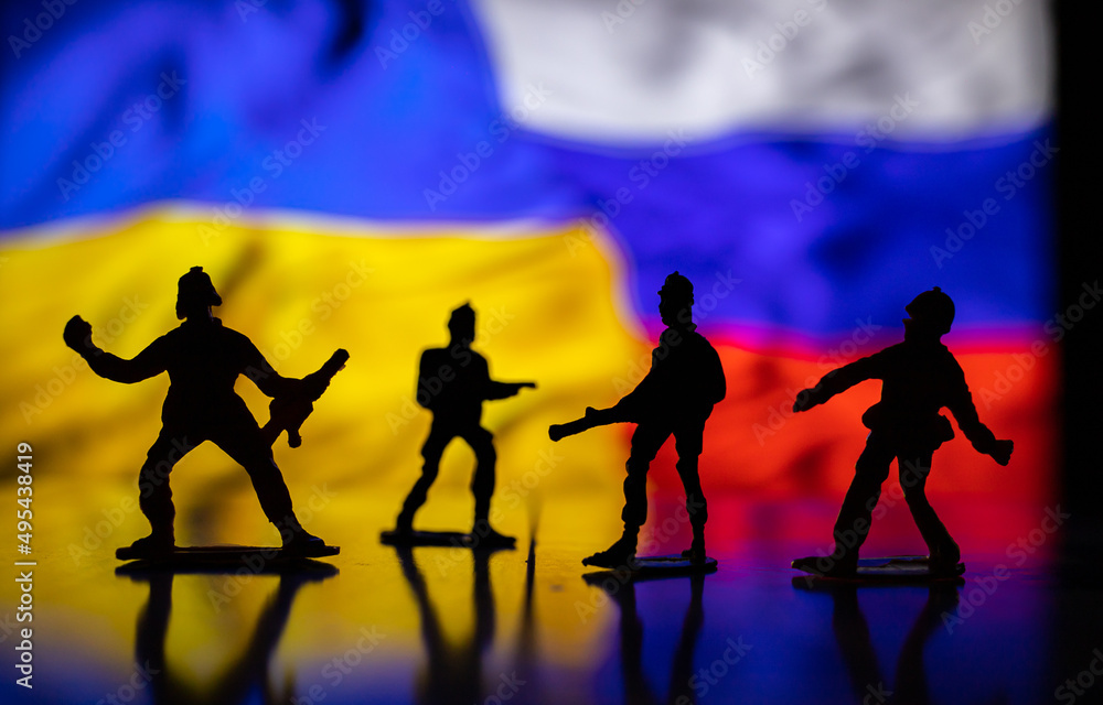 War between Russia and Ukraine, conceptual image of war using chess board, warring soldiers and national flags on the background. Ukrainian & Russian crisis, political conflict. Stop the war 2022 War between Russia and Ukraine, conceptual image of war using chess board, warring soldiers and national flags on the background. Ukrainian & Russian crisis, political conflict. Stop the war 2022