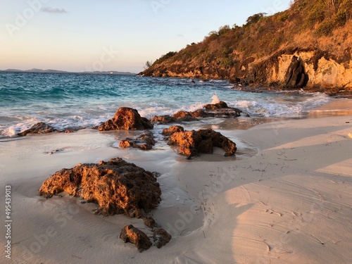 Brown rocks on sea shore photo