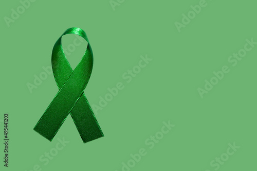 Green April, month of awareness about the importance of safety at work. Green ribbon