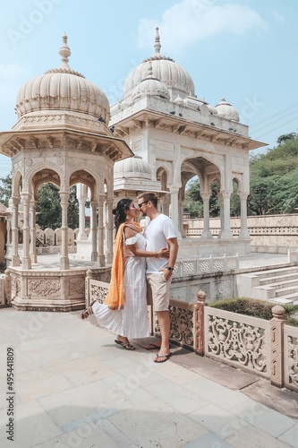 Man and woman kissing in Gaitore Ki Chhatriyan Monument in Jaipur, India photo