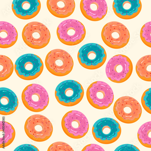 Seamless pattern of three colored donuts on beige background	 photo