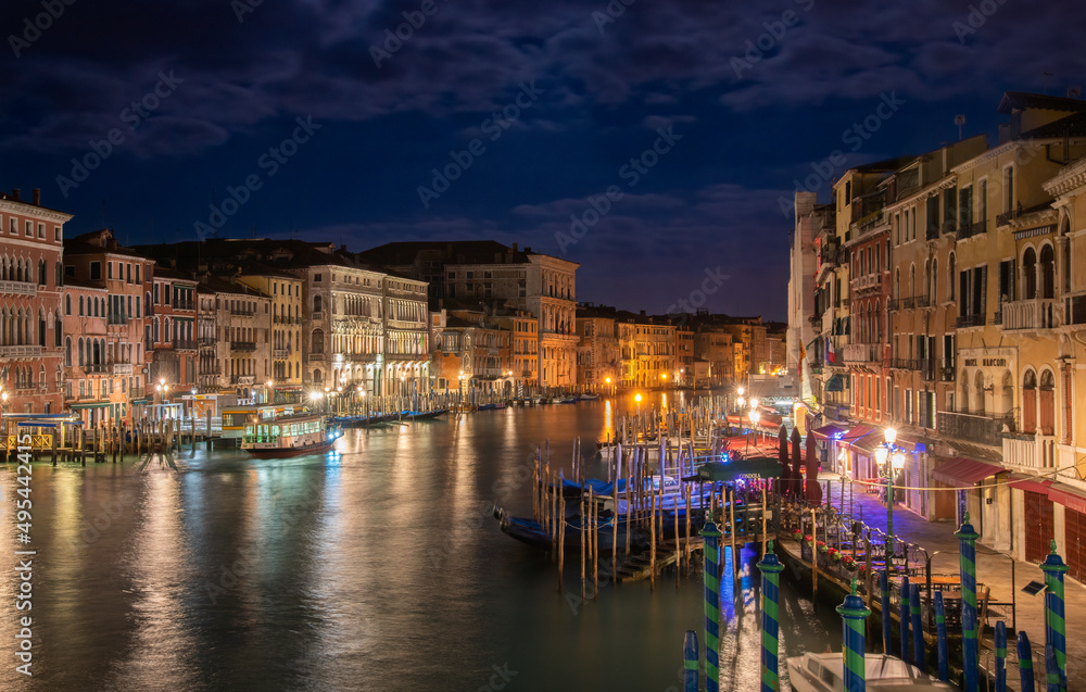 The Grand Canal from the Rialto bridge by night in Venice, Italy