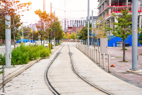 Photography Deserted tramway along a construction site in a downtown district on a cloudy autumn day