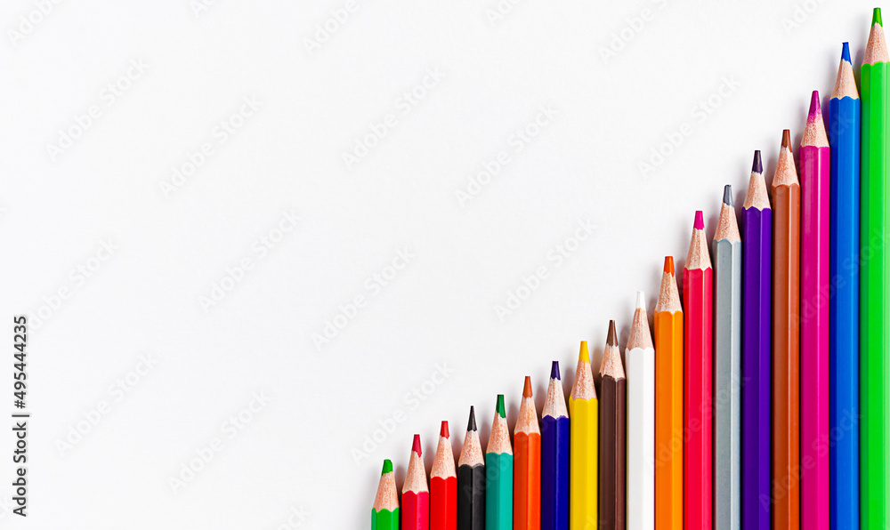 Fototapeta premium Colorful pencils on white background. Flat lay, copy space. Back to school concept