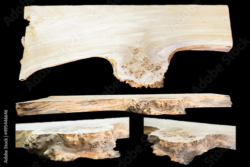 Solid wood blanks for for exclusive custom-made furniture on black background. Texture of a polished cut ofwood. Woodworking, carpentry production.