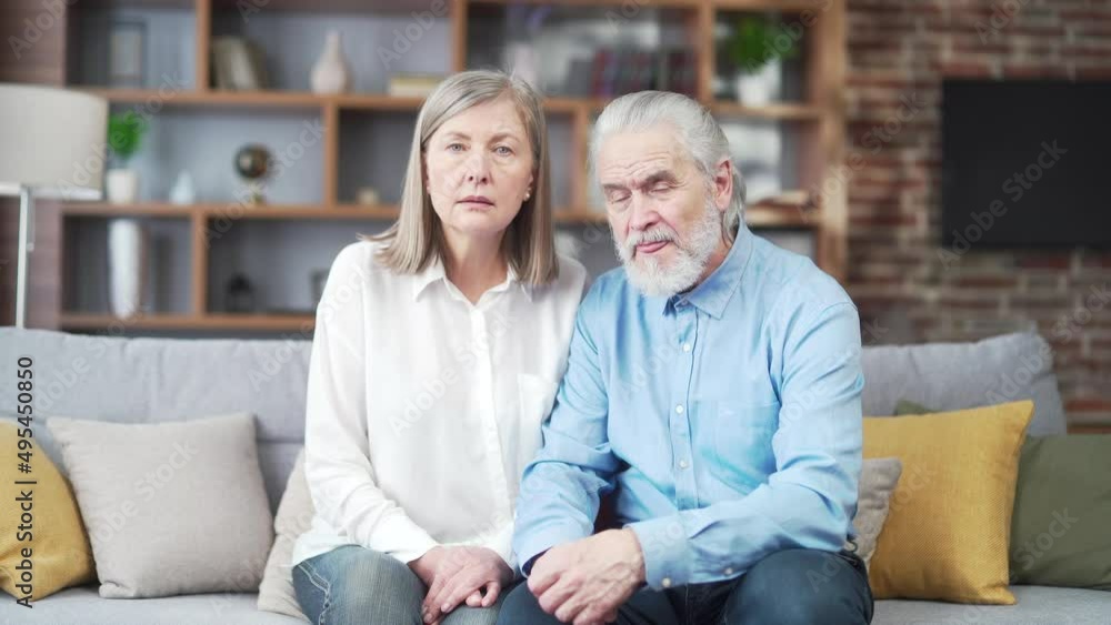 Portrait gray hair senior couple Elderly person patients look at camera and listen online consultation remotely. Older families listen carefully to the doctor or lawyer's advice in home Webcam view Portrait gray hair senior couple Elderly person patients look at camera and listen online consultation remotely. Older families listen carefully to the doctor or lawyer's advice in home Webcam view