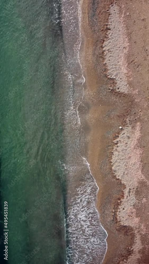 Aerial view of waves crashing on beach Aerial view of waves crashing on beach