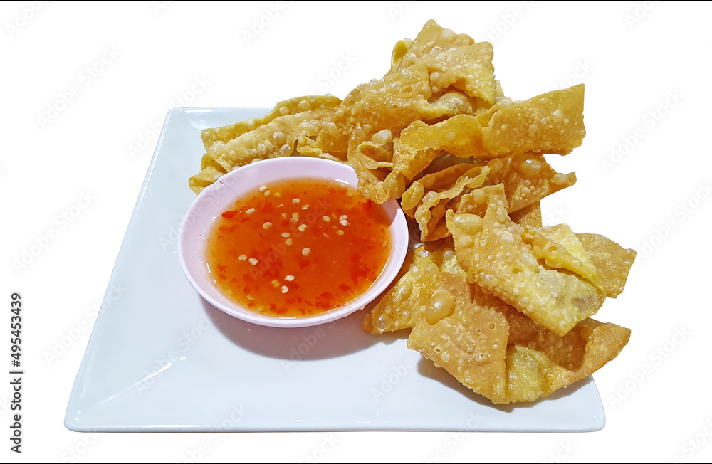 Fried dumplings served on a plate with sauce on white background Fried dumplings served on a plate with sauce on white background