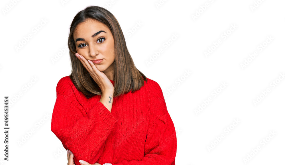 Beautiful brunette woman wearing casual winter sweater thinking looking tired and bored with depression problems with crossed arms. Beautiful brunette woman wearing casual winter sweater thinking looking tired and bored with depression problems with crossed arms.