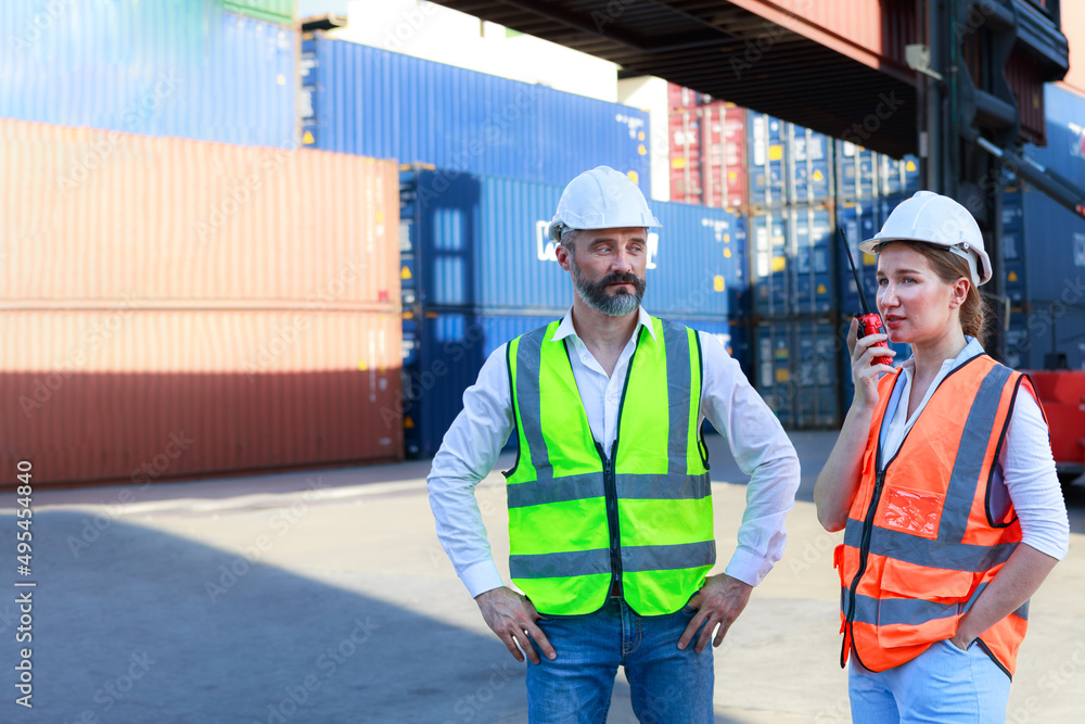 Executives, businessmen and engineers or foremen check control Warehouse at the container yard Executives, businessmen and engineers or foremen check control Warehouse at the container yard