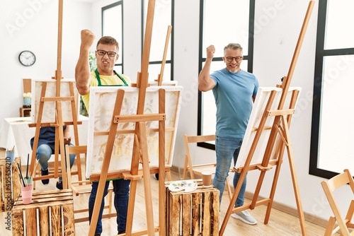Group of middle age people artist at art studio annoyed and frustrated shouting with anger, yelling crazy with anger and hand raised