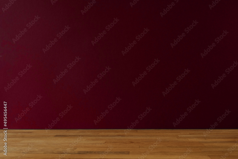 Dark red background for copy space and wooden table Dark red background for copy space and wooden table