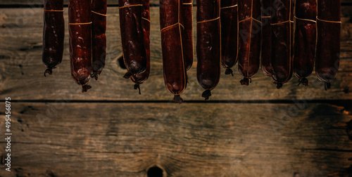 Traditional smokehouse. Traditional food. Smoked sausages meat. Sausages smoke in a smokehouse. Long banner format
