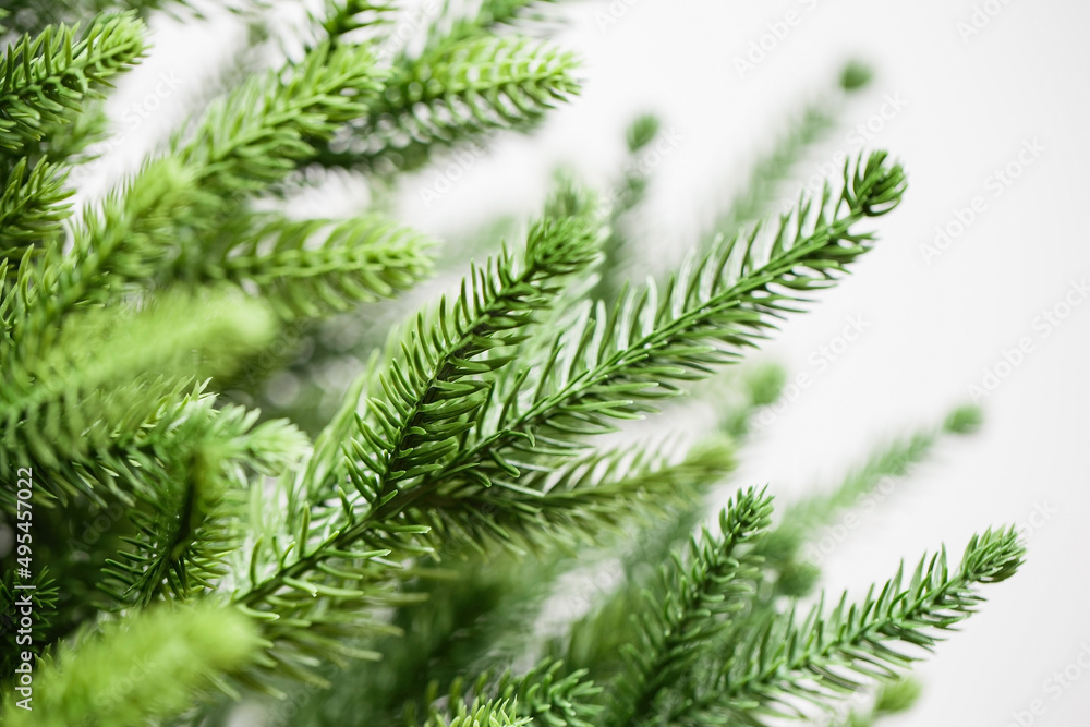 Fluffy branches of spruce. Artificial cast needles. Christmas branches on a white background Fluffy branches of spruce. Artificial cast needles. Christmas branches on a white background