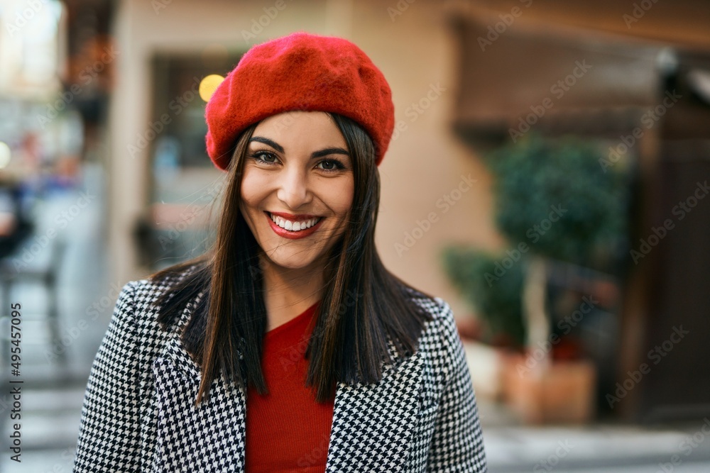 Young hispanic woman smiling happy standing at the city. Young hispanic woman smiling happy standing at the city.