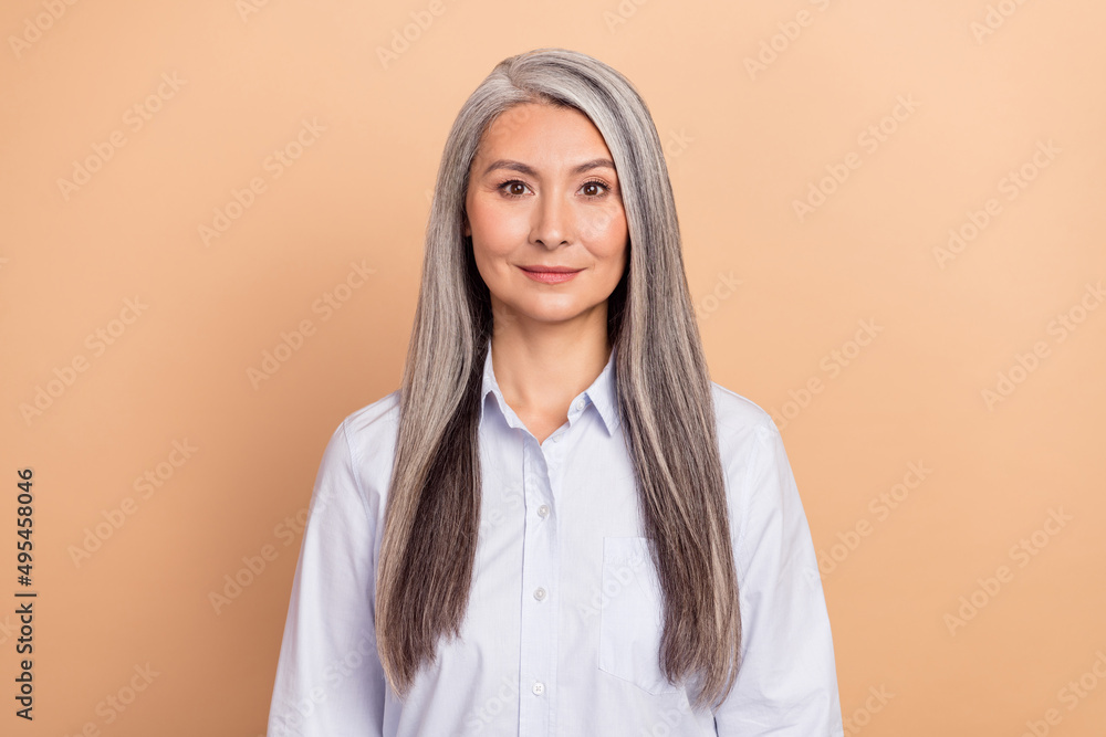 Fototapeta premium Photo of mature adorable lady intelligent attorney marketer chief isolated over beige color background