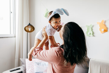 Mother and her baby celebrating Easter at home