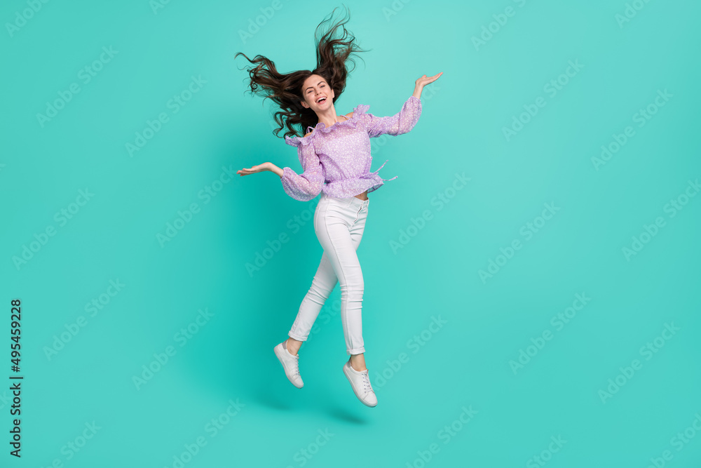 Full body photo of satisfied adorable person hands throw hair have fun isolated on turquoise color background