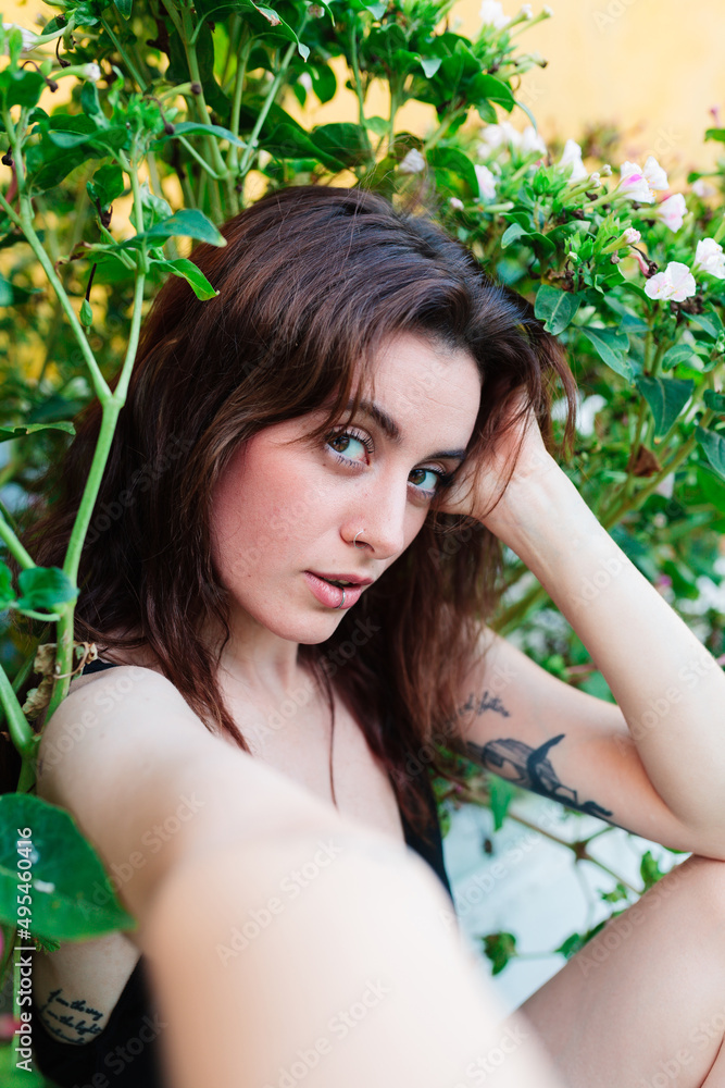 Photo of adorable young woman making selfie outdoors backyard Photo of adorable young woman making selfie outdoors backyard
