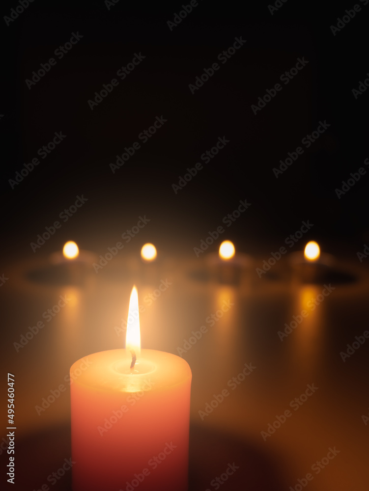 Light a candle in the dark, the flame warms and the light creates bokeh. Light and shadow create atmosphere. Things such as romantic, mysterious, interesting, and also make you feel faith. Light a candle in the dark, the flame warms and the light creates bokeh. Light and shadow create atmosphere. Things such as romantic, mysterious, interesting, and also make you feel faith.