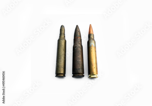 isolated old ak and m16 bullets on white background, soft and selective focus.