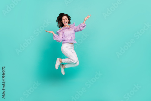 Full body portrait of satisfied peaceful lady raise hands palms toothy smile isolated on teal color background