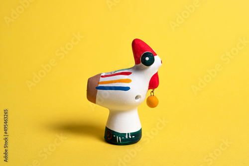 Cucù whistles, typical souvenirs in Matera, the cave city in Basilicata (Italy). Yellow Background