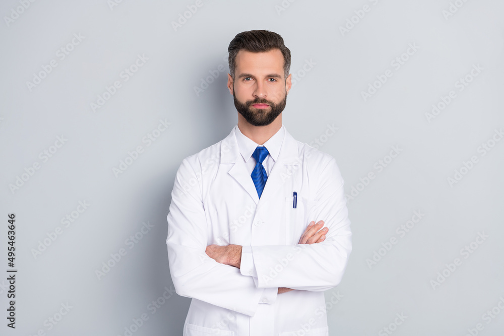 Portrait of attractive skilled smart experienced successful medic director professor folded arms isolated on grey color pastel background Portrait of attractive skilled smart experienced successful medic director professor folded arms isolated on grey color pastel background