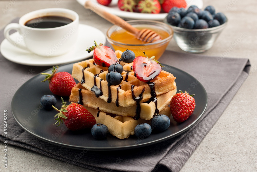Belgian waffles for breakfast. Dessert food concept. Belgian waffles for breakfast. Dessert food concept.