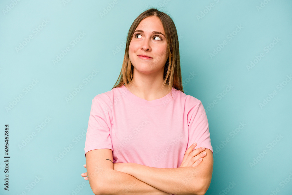 Young caucasian woman isolated on blue background dreaming of achieving goals and purposes Young caucasian woman isolated on blue background dreaming of achieving goals and purposes