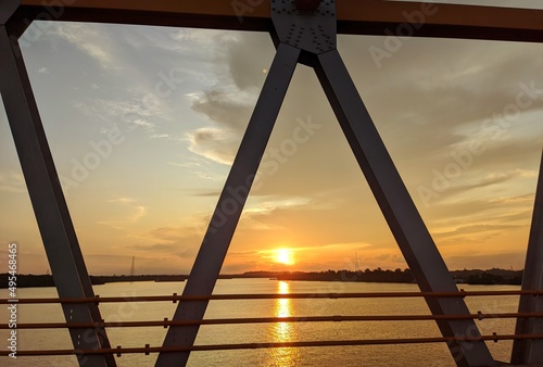 bridge over the river,beautiful sunset and river from bridge dondang east kalimantan photo
