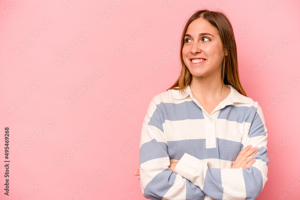 Young caucasian woman isolated on pink background smiling confident with crossed arms. Young caucasian woman isolated on pink background smiling confident with crossed arms.