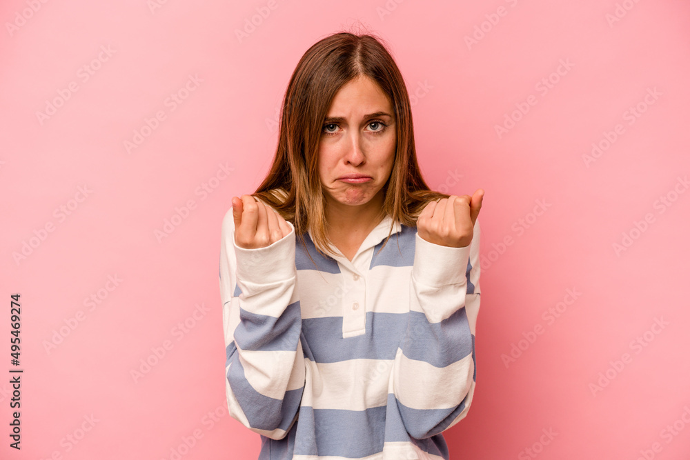 Young caucasian woman isolated on pink background showing that she has no money.