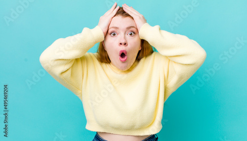 Slika na platnu pretty red head woman looking unpleasantly shocked, scared or worried, mouth wid