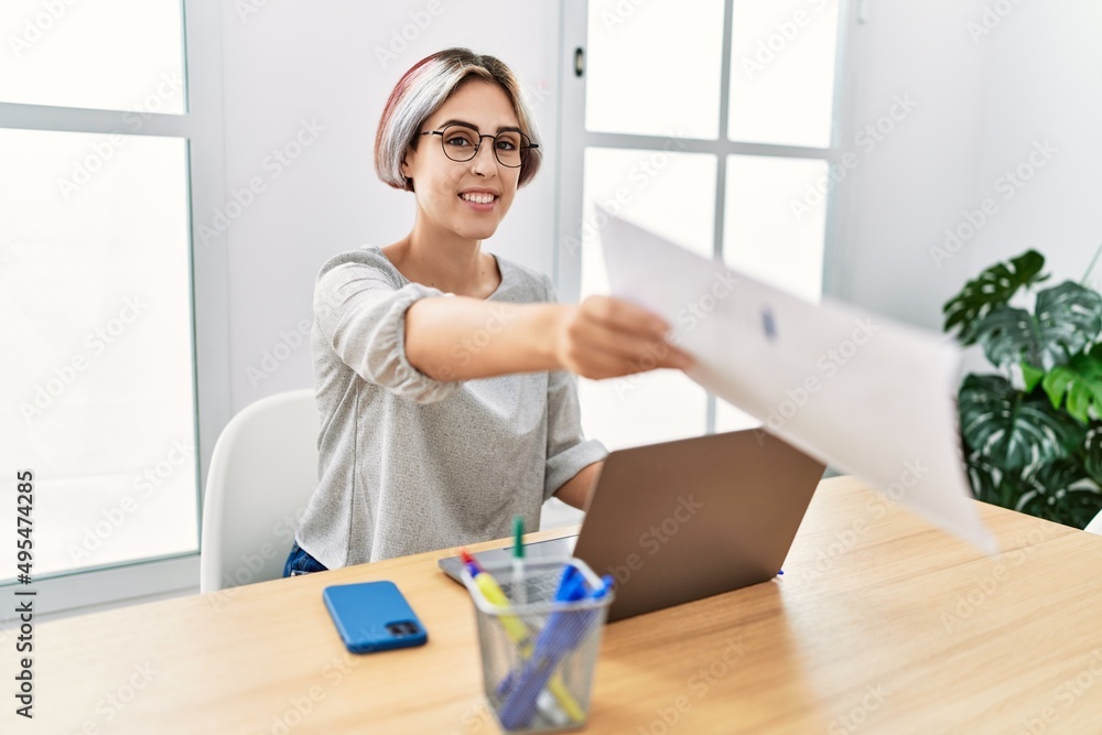 Young caucasian businesswoman using laptop working at the office. Young caucasian businesswoman using laptop working at the office.