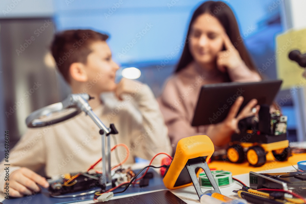 Children making a robot at home. Education in robotic at home. Children making a robot at home. Education in robotic at home.