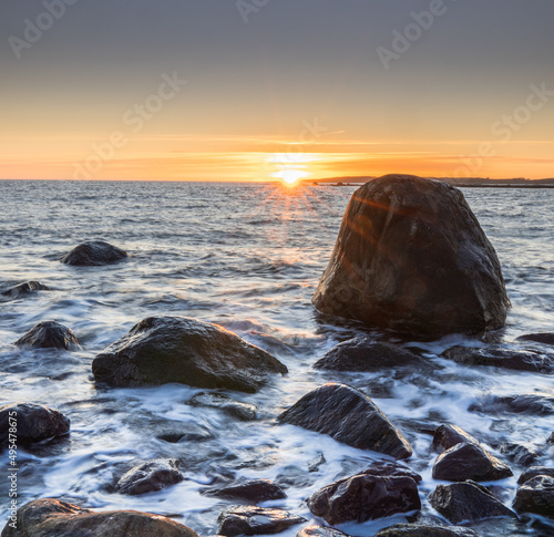 Sunset on skerries in Ytre Hvaler National Park, on the island of Kirkeoy in Norway photo