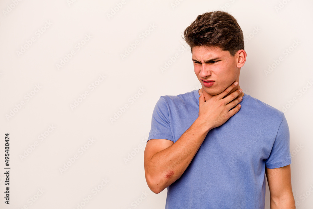 Young caucasian man isolated on white background touching back of head, thinking and making a choice. Young caucasian man isolated on white background touching back of head, thinking and making a choice.