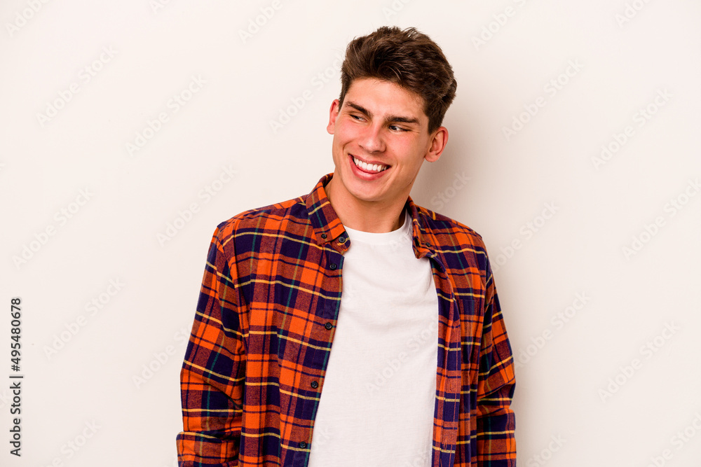 Young caucasian man isolated on white background laughs and closes eyes, feels relaxed and happy. Young caucasian man isolated on white background laughs and closes eyes, feels relaxed and happy.