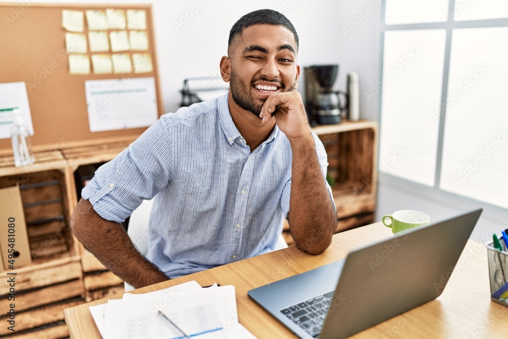 © Krakenimages.com - Young arab man smiling confident working at office