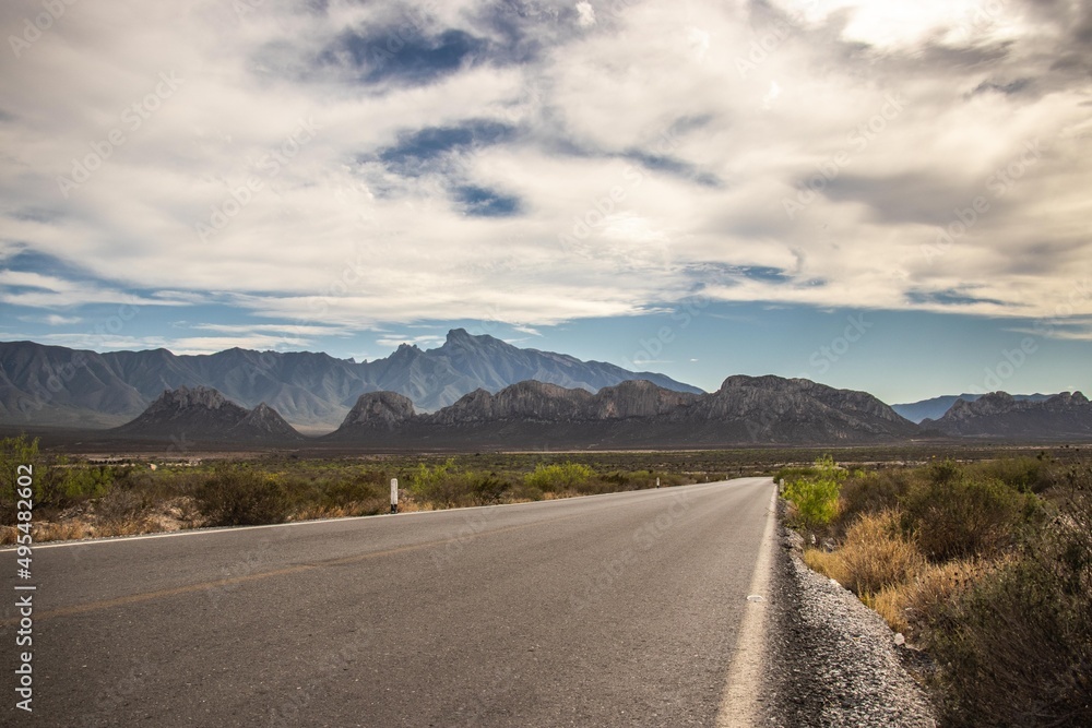 Naklejka premium Mountains on the end of the road