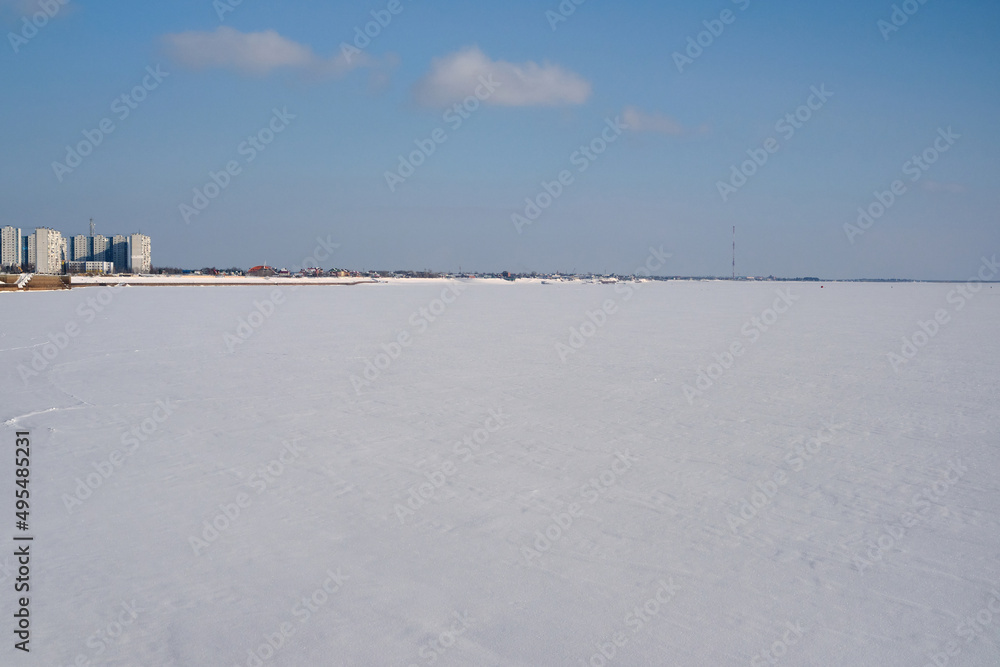 View of the frozen river Ob from the Bank of the city of Nizhnevartovsk. Frozen Ob river in the winter. Ob river, Western Siberia