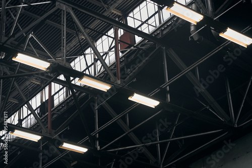 a lamp burning in the dark of factories