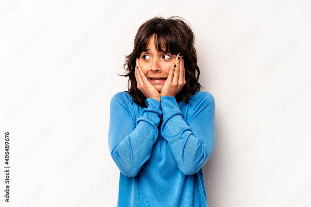 Young hispanic woman isolated on white background scared and afraid. Young hispanic woman isolated on white background scared and afraid.