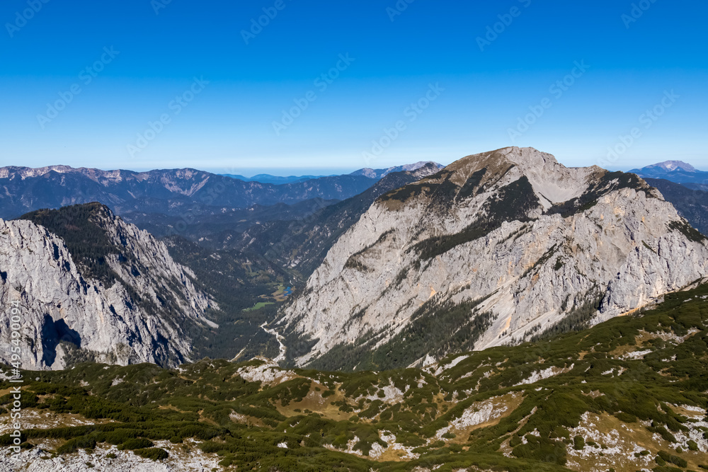 Panoramic view on the mountain peaks of the Hochschwab Region in Upper Styria, Austria.Summit of Riegerin in the beautiful Alps in Europe. Climbing tourism, wilderness. Concept freedom. Brunnsee
