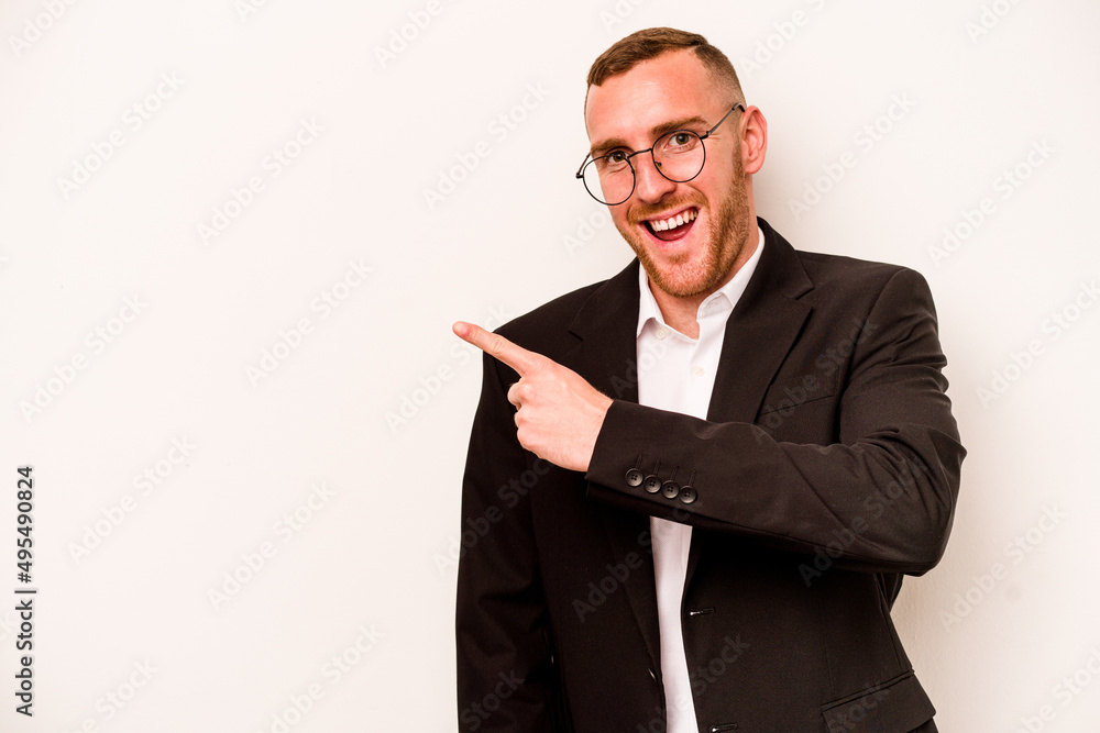 Young business caucasian man isolated on white background smiling and pointing aside, showing something at blank space. Young business caucasian man isolated on white background smiling and pointing aside, showing something at blank space.