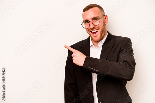 Young business caucasian man isolated on white background smiling and pointing aside, showing something at blank space.