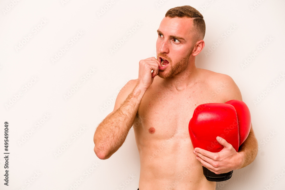 Young caucasian man doing boxing isolated on white background relaxed thinking about something looking at a copy space. Young caucasian man doing boxing isolated on white background relaxed thinking about something looking at a copy space.