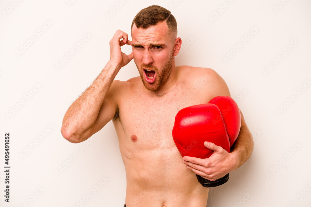 Young caucasian man doing boxing isolated on white background covering ears with hands. Young caucasian man doing boxing isolated on white background covering ears with hands.