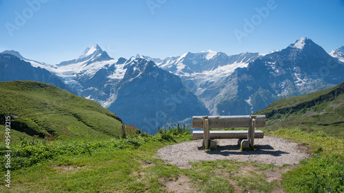 wooden bench with stunning view to Bernese Alps Grindelwald
